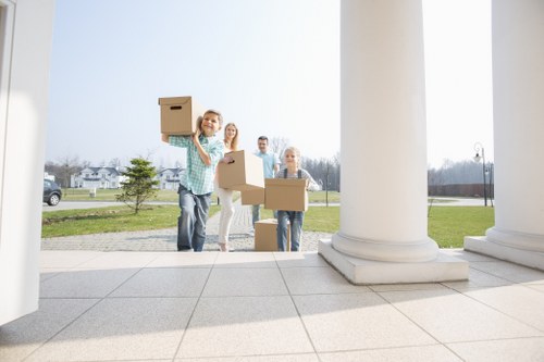 Trained moving staff preparing items carefully for transport
