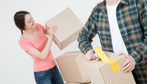 Careful loading of household items into a removal van