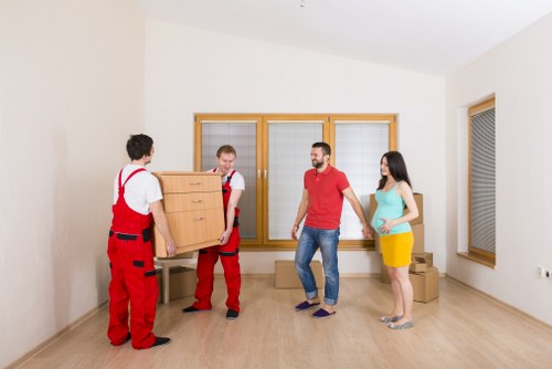 Professional movers loading furniture and boxes for a Grange Park home relocation