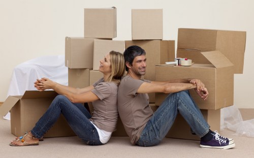 Packed office boxes and workstation items ready for transport